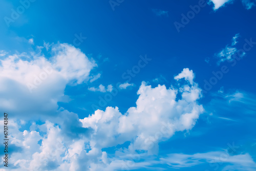 Blue sky with clouds background.