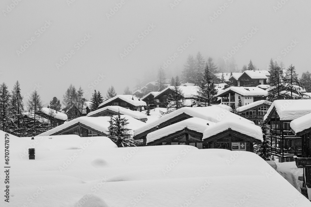 Roof of houses covered with snow during cold winter day Roof of houses covered with snow during cold winter day