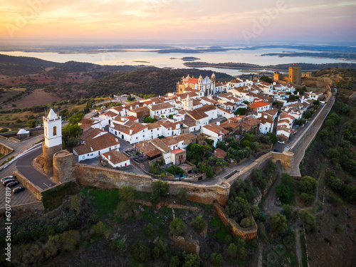 Aerial view of Monsaraz a tiny charming village inside castle walls in Alentejo region of Portugal, at sunrise