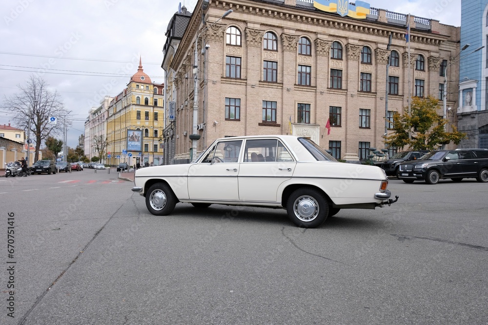 Beautifully restored classic Mercedes car parked on street