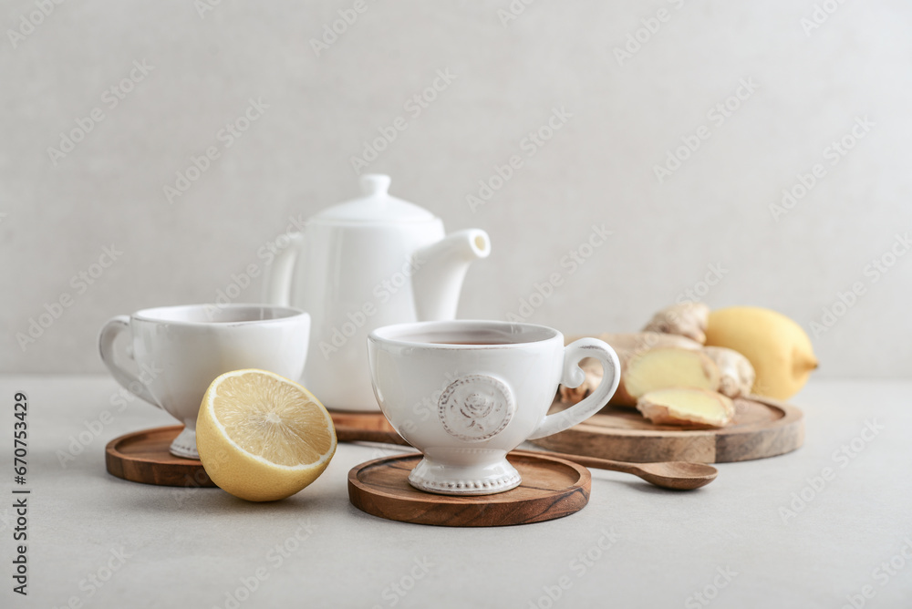 Ginger tea with lemon in a white cups Ginger tea with lemon in a white cups