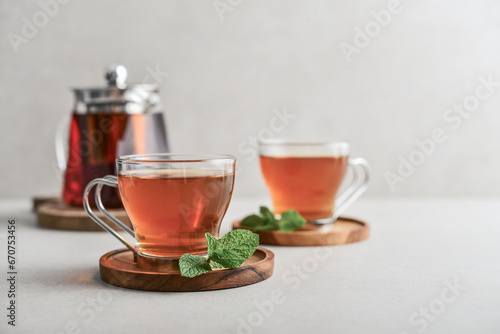 Tea in a glass cups with glass teapot