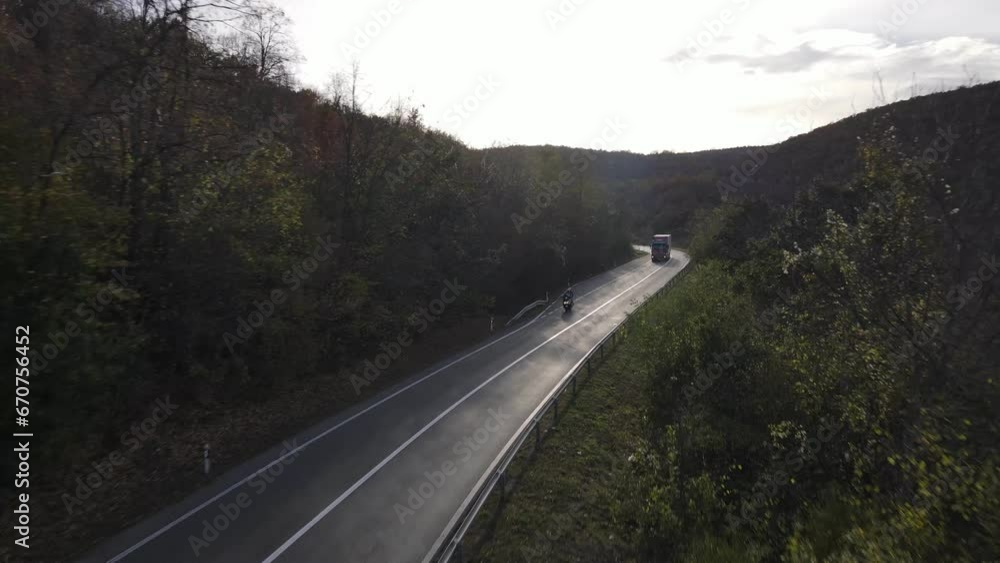 Aerial Drone View truck Drive on Curvy Mountain asphalt Road in Autumn Aerial Drone View truck Drive on Curvy Mountain asphalt Road in Autumn