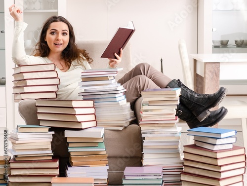 Young female student preparing for exams at home