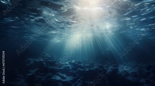 blue underwater with rays of sun background, under water turquoise wallpaper © goami