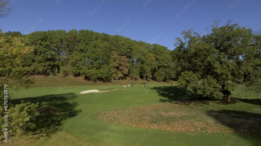 Aerial Of People Playing At A Green Golf Course Against Sky - Manhasset, New York Aerial Of People Playing At A Green Golf Course Against Sky - Manhasset, New York