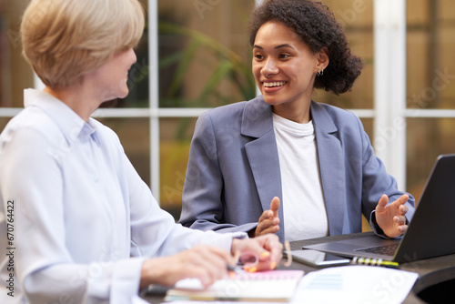 Wallpaper Mural Creative team collaborating on project during meeting in outdoor cafe. Conception of business Torontodigital.ca