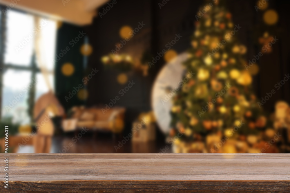 Wooden table in room decorated for Christmas. Space for design Wooden table in room decorated for Christmas. Space for design
