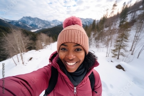 Social Media influencer Young hiker woman taking selfie video portrait on the top of mountain