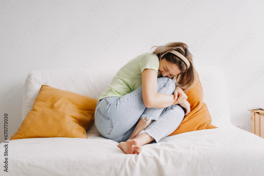 Laugh and happy asian woman alone on the sofa. Good vibes and chill mood. Laugh and happy asian woman alone on the sofa. Good vibes and chill mood.