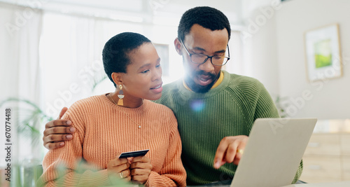 Payment, credit card and a black couple with a laptop for online shopping, banking or search on website. Ecommerce, house and an African man and woman reading information to pay from an email