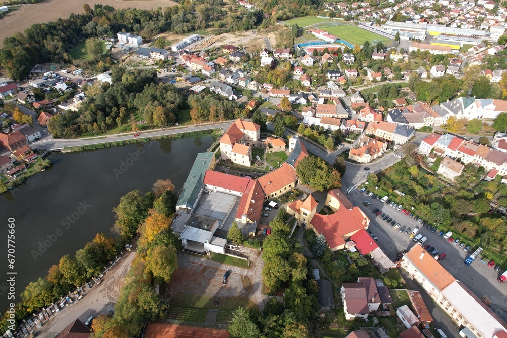 Fototapeta premium Polna historical city center of Bohemian town with square,column and cathedral and Polna castle,aerial panorama landscape view,Czech republic,Europe