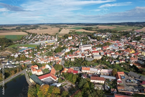 Polna historical city center of Bohemian town with square,column and cathedral and Polna castle,aerial panorama landscape view,Czech republic,Europe photo