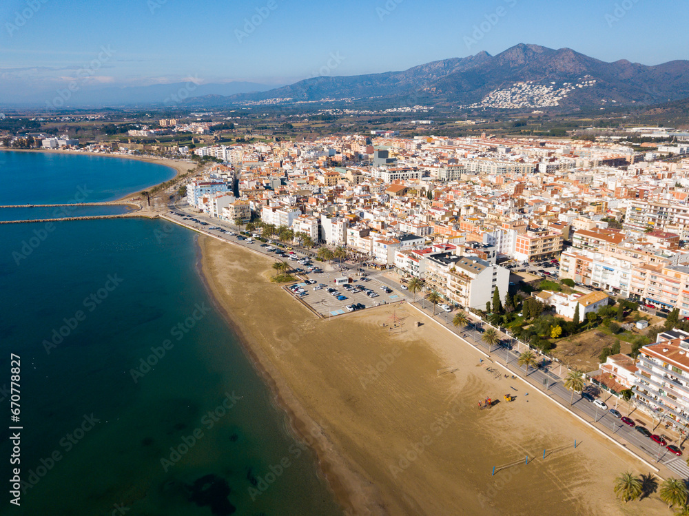 Panoramic aerial view of waterfront promenade in city Roses, Catalonia
