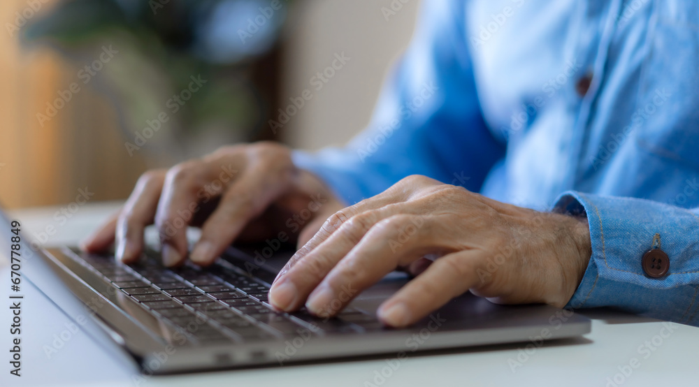 Man working online with laptop computer on desktop screen for advertising, mockup, technology, advertising, search information, blogger, creative design, learning, webinar, shopping, study, watching Man working online with laptop computer on desktop screen for advertising, mockup, technology, advertising, search information, blogger, creative design, learning, webinar, shopping, study, watching