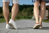 Romantic date. Couple walking outdoors, closeup view
