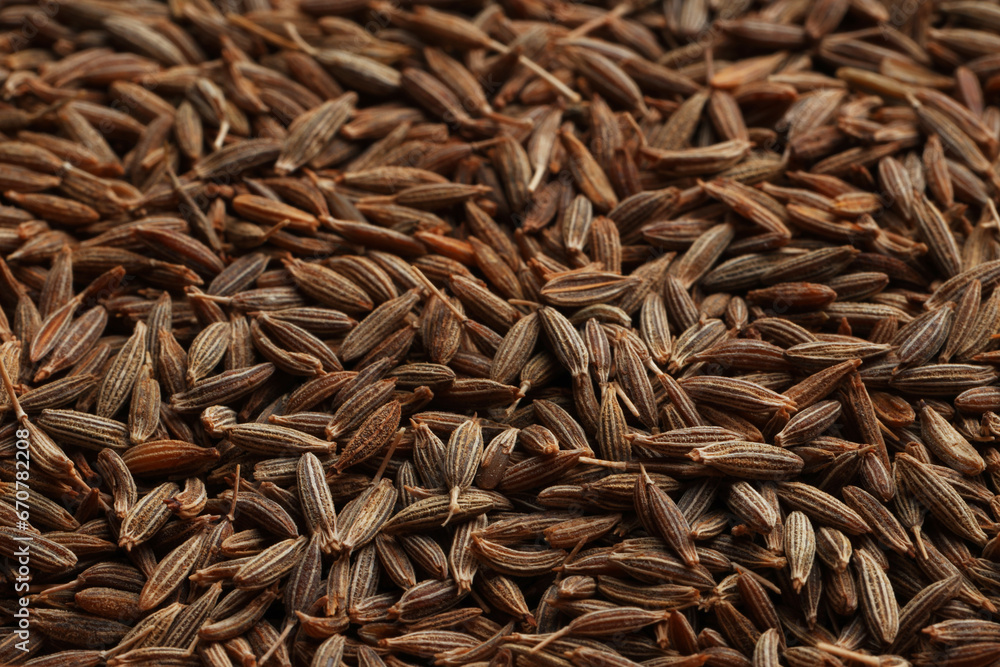 Aromatic caraway seeds as background, closeup view Aromatic caraway seeds as background, closeup view