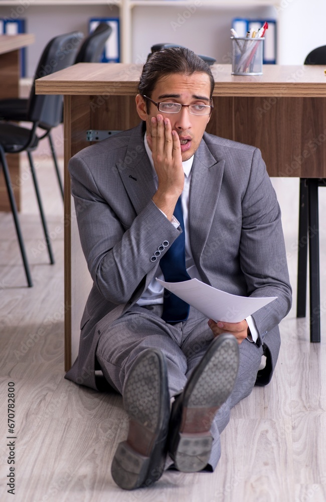 Unhappy male businessman in the office Unhappy male businessman in the office