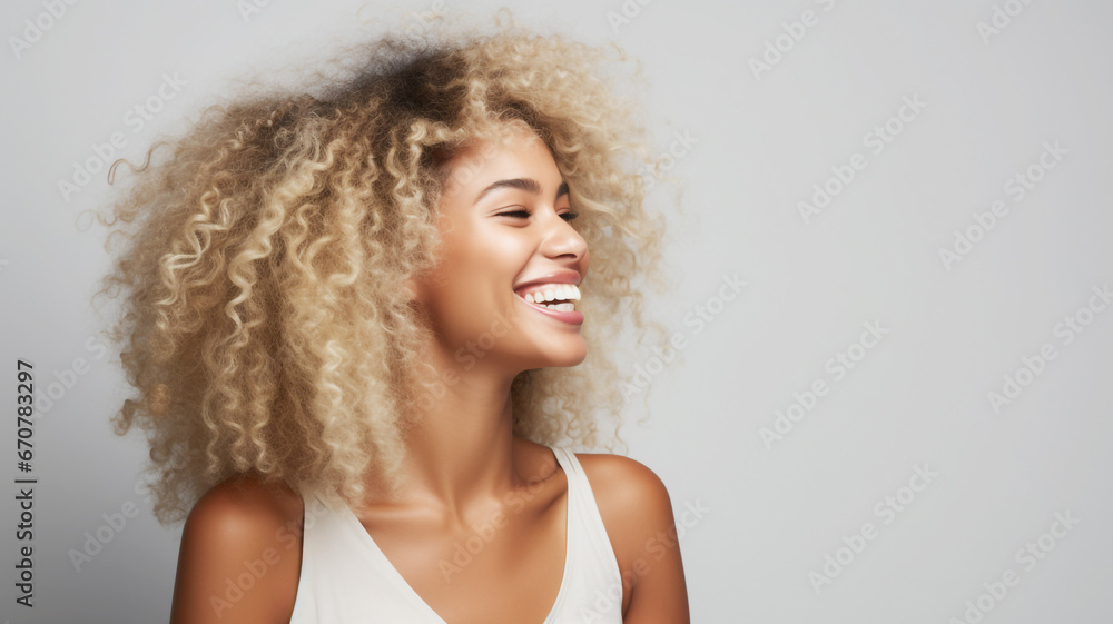 Happy young african american woman on a solid background