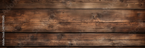 Old dark wood planks texture background, vintage brown wooden long boards of barn wall. Panoramic wide banner. Theme of rustic design, nature, wallpaper, woodgrain, material