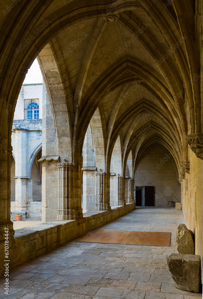 Gallery with arches in courtyard of medieval Cathedral of Saint Nazaire, Beziers