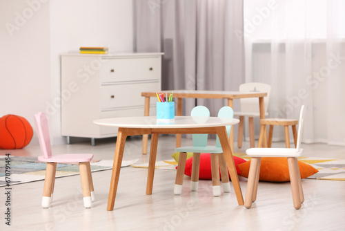 Child`s playroom with comfortable furniture. Stylish kindergarten interior © New Africa