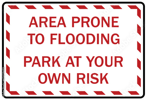 Flood danger sign and labels area prone to flooding. Park at your own risk