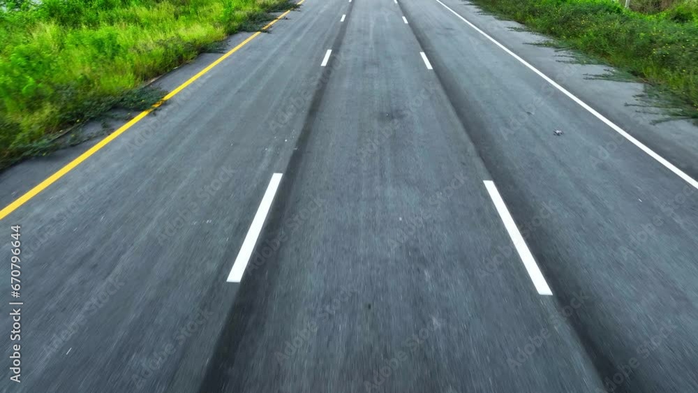 Aerial drone view : An immaculate intercity motorway, devoid of traffic, winds gracefully through the landscape, a masterpiece of modern engineering, beckoning adventure from above. Transport concept. Aerial drone view : An immaculate intercity motorway, devoid of traffic, winds gracefully through the landscape, a masterpiece of modern engineering, beckoning adventure from above. Transport concept.