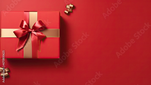 christmas red gift box with ribbon on red background