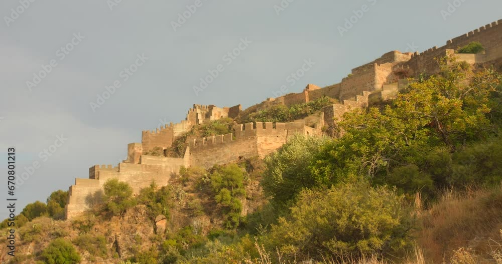 Low angle of Sagunt Castle Ruins during sunny day in Spain. Low angle of Sagunt Castle Ruins during sunny day in Spain.