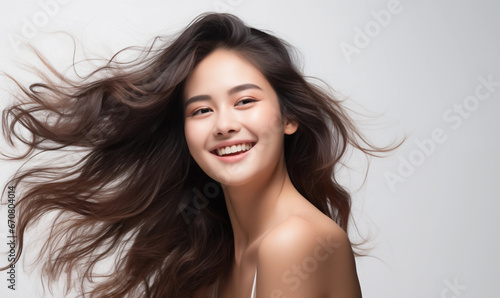 Portrait of a beautiful Asian woman with flowing black hair. Bright smile, shampoo advertising concept Hair conditioner and cosmetic products, Generation AI