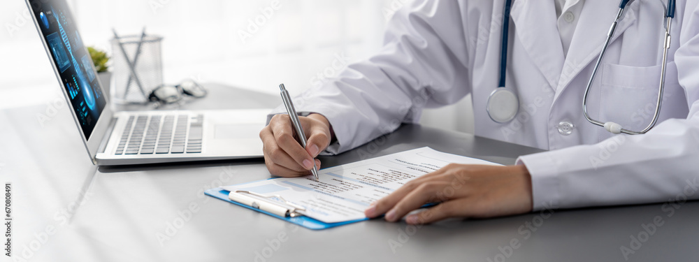 Doctor carefully review detailed medical report with laptop and diagnosing illness for effective healthcare treatment plan for patient in doctor office. Professional medical evaluation. Neoteric - obrazy, fototapety, plakaty 