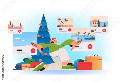 woman tourist in santa hat use augmented or virtual reality exploring destination headset technology innovation happy new year concept