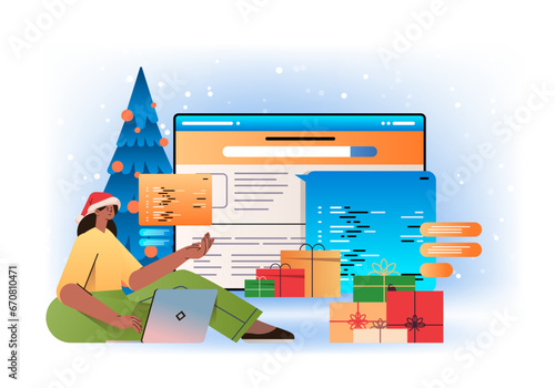 web developer woman in santa hat creating program code on laptop screen development of software and programming concept