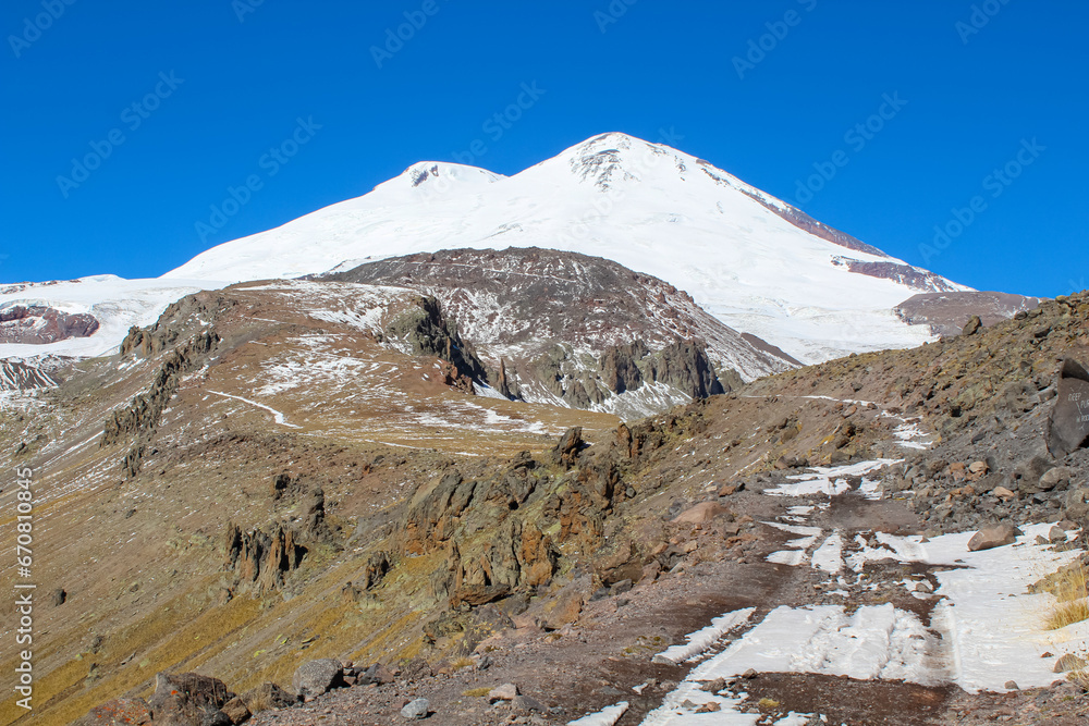 The path to mount Elbrus against the blue sky, Russia