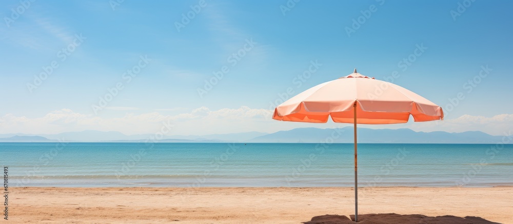 Beach in Florian polis Brazil with sand and an umbrella - obrazy, fototapety, plakaty 