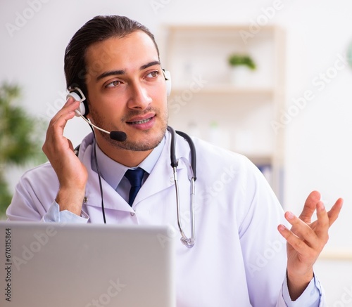 Young doctor listening to patient during telemedicine session