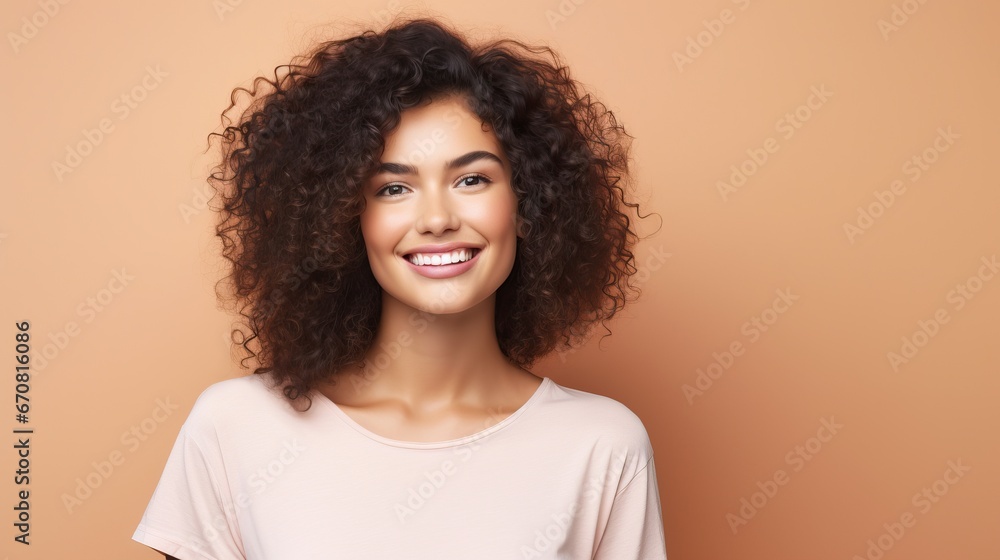 Portrait of a cheerful young woman wearing pink shirt standing isolated over pink background, looking at camera, posing Portrait of a cheerful young woman wearing pink shirt standing isolated over pink background, looking at camera, posing