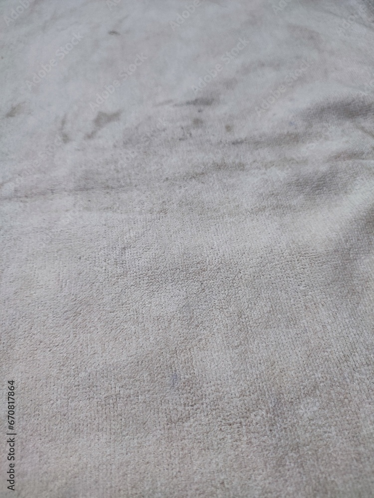 texture, pattern, background of a dirty, unwashed white towel