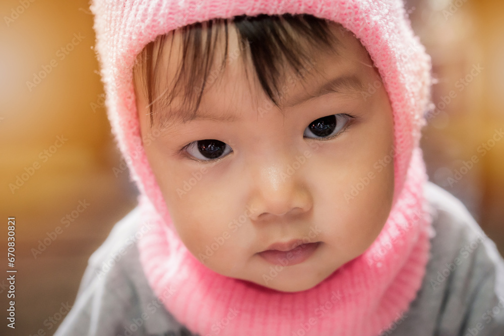 Asian cute little baby in winter hat Asian cute little baby in winter hat