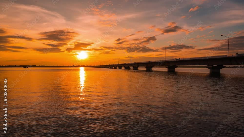 4K Time Lapse beautiful sunset scenery The stunning light of nature at Thepsuda Bridge The longest river bridge and is popular tourist attraction in Kalasin Thailand. 4K Time Lapse beautiful sunset scenery The stunning light of nature at Thepsuda Bridge The longest river bridge and is popular tourist attraction in Kalasin Thailand.