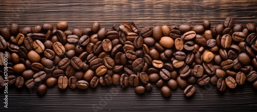 Coffee beans displayed on a wooden surface © 2rogan