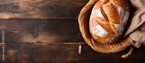Artisanal bread placed in a basket on a table captured from a bird s eye perspective