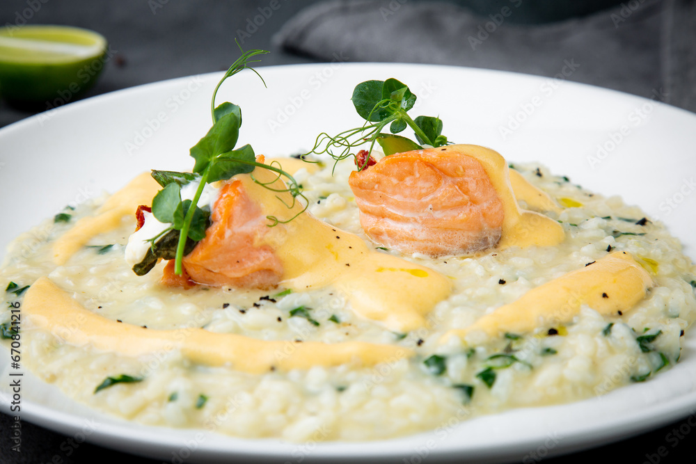 white rice porridge with herbs and fish, side view white rice porridge with herbs and fish, side view