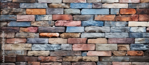 Brick wall with multicolored background