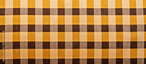 Checkered textile background for design purposes with a yellow brown color scheme