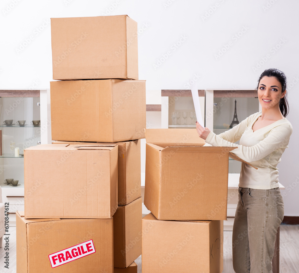 Young woman moving to new flat Young woman moving to new flat