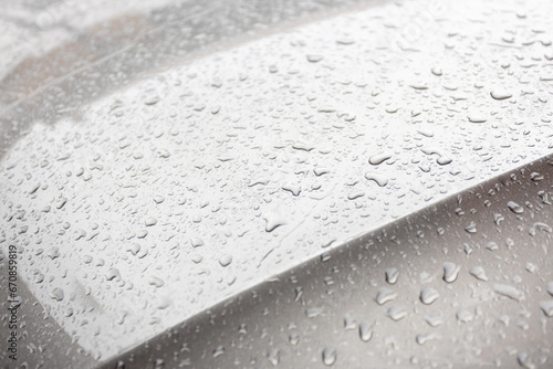 Raindrops on a car hood