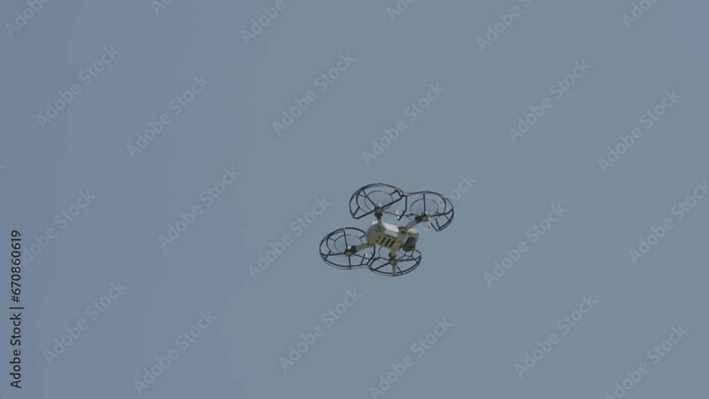 Witness the marvel of modern technology as an individual drone hovers gracefully in the boundless sky on a pristine, clear day. The fusion of innovation and nature creates a captivating scene. Witness the marvel of modern technology as an individual drone hovers gracefully in the boundless sky on a pristine, clear day. The fusion of innovation and nature creates a captivating scene.