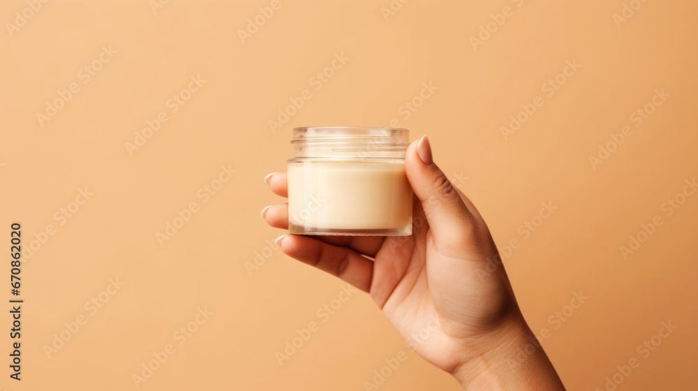 Close up of hand holding a jar of cosmetics product. Skincare hygiene moisturiser - obrazy, fototapety, plakaty 